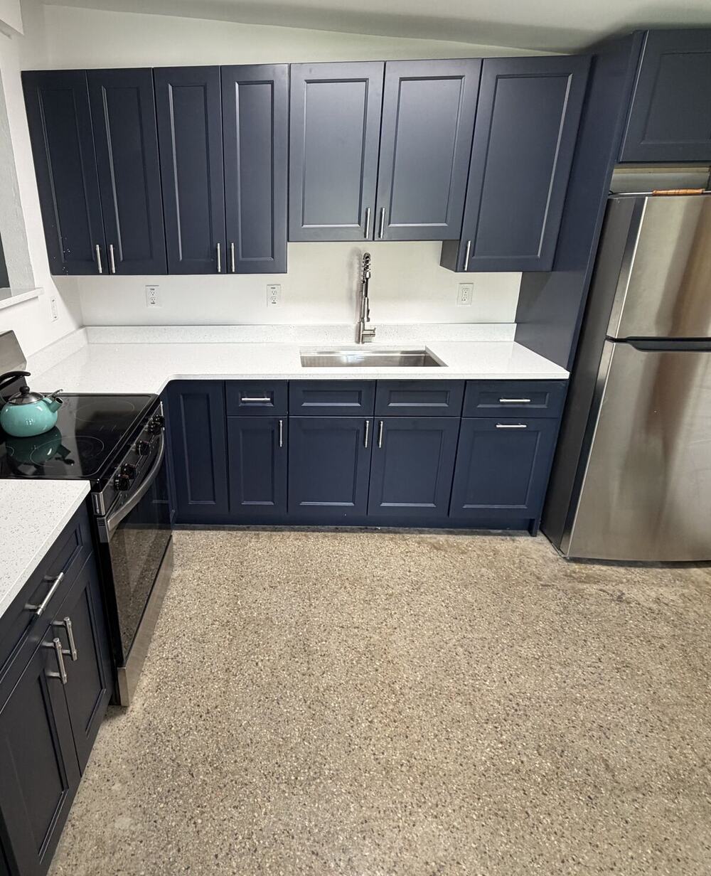 Completed Tampa kitchen with shaker cabinets and light countertops